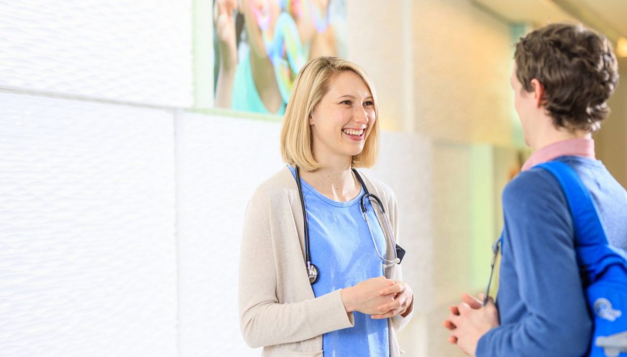 03-Health-centre-reception-area-with-young-female-nurse-talking-to-a-young-man-1340x764.jpg